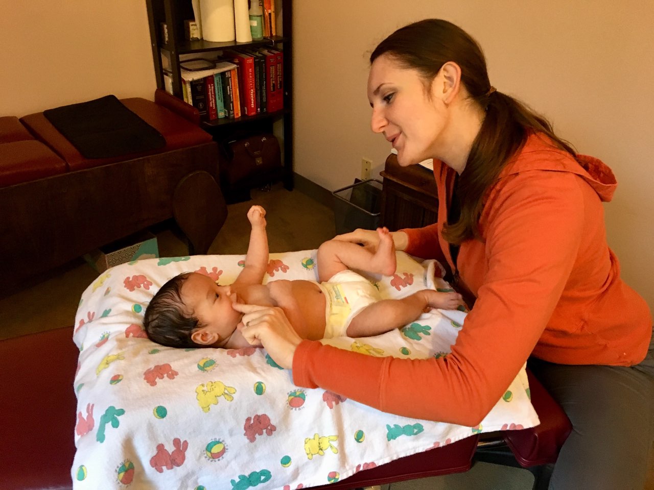 Chiropractor, Dr. Sharonrose Samelak, adjusting an infant.